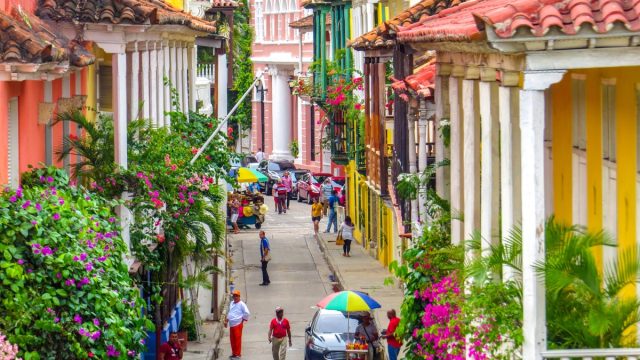 Street in walled city in Cartagena Colombia with people walking