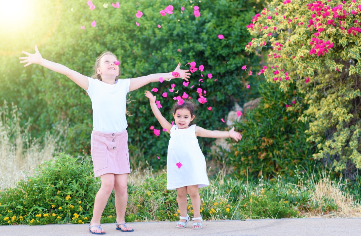 Kids throwing flower petals