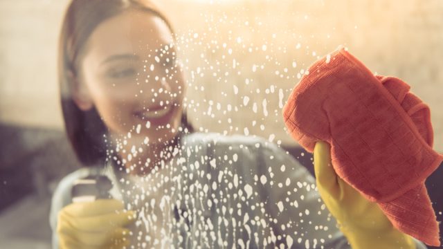 Woman cleaning a shower