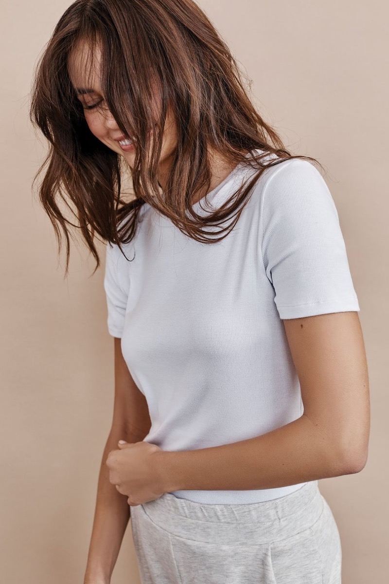 young white woman in white t-shirt