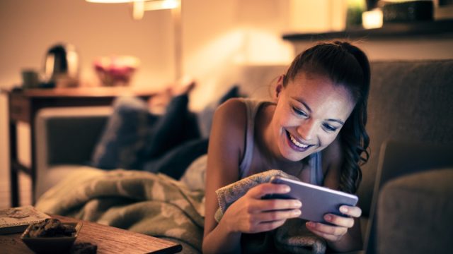 woman watching videos on her phone