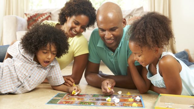 Family playing board game