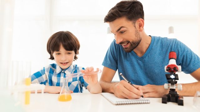 Kid doing science experiment
