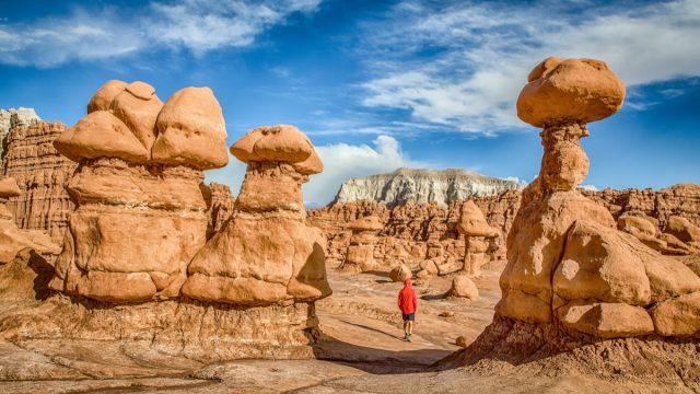 man walks in goblin valley state park