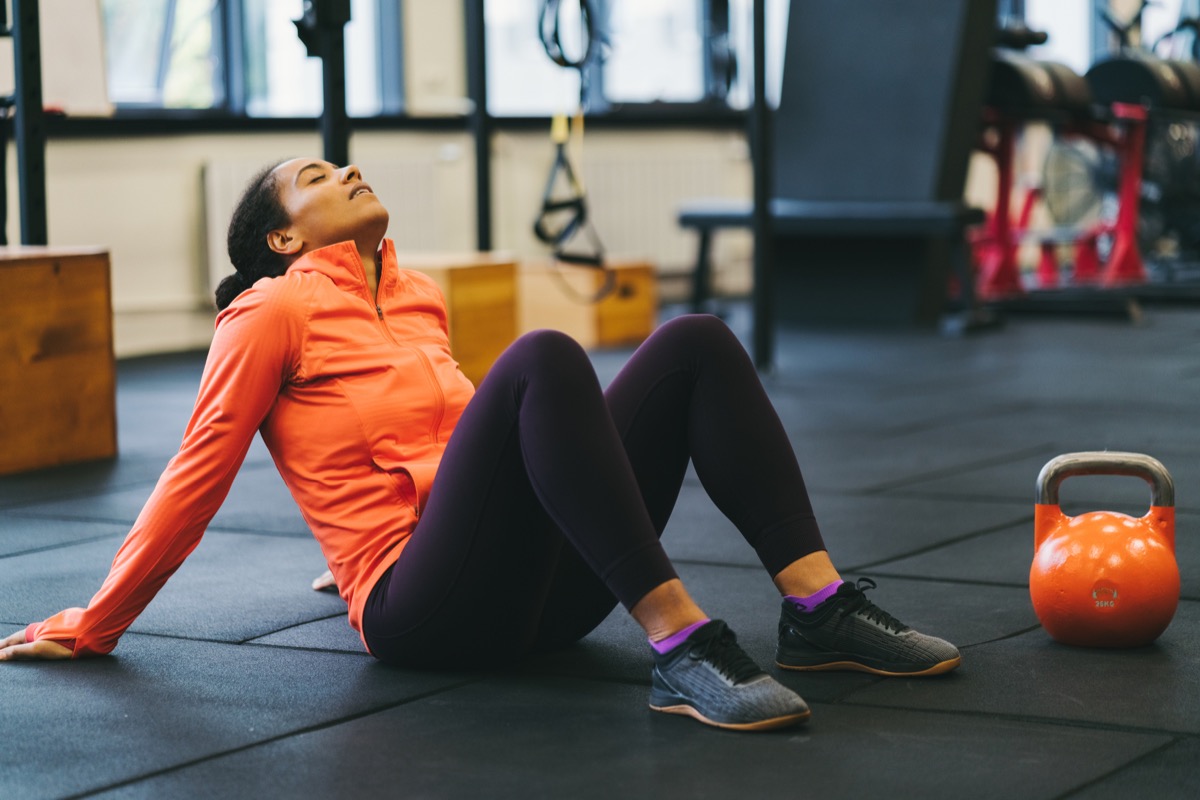 Woman tired after exercising at gym