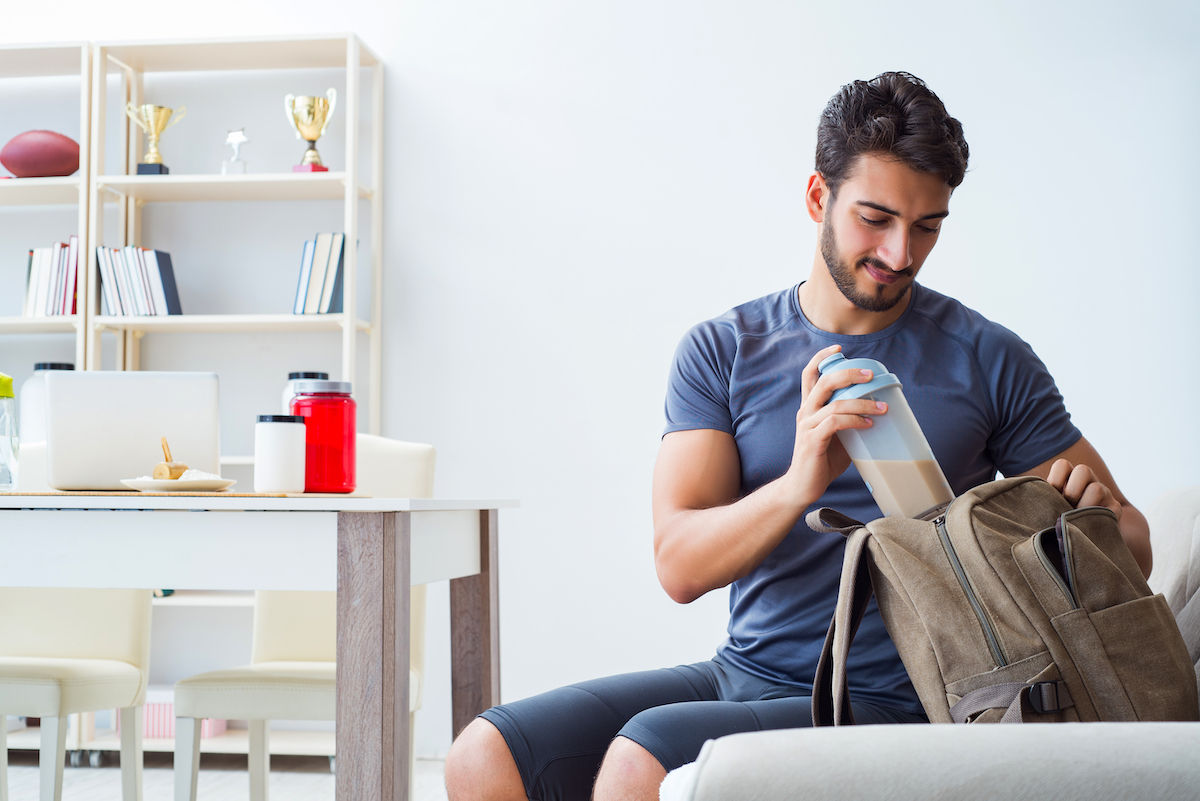 Man packing protein shake for workout