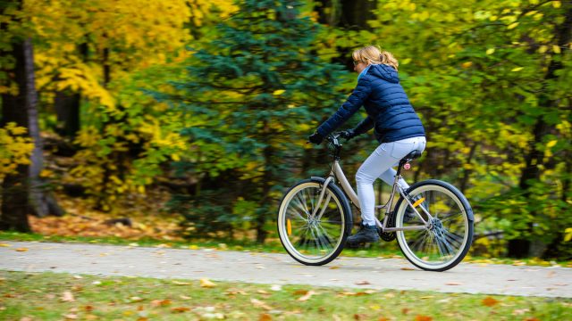 Woman riding a bike in the park