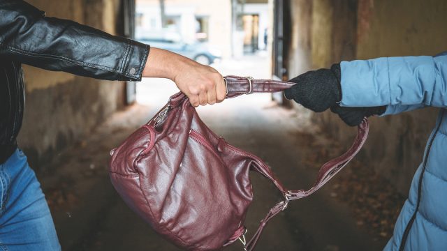 Purse being stolen