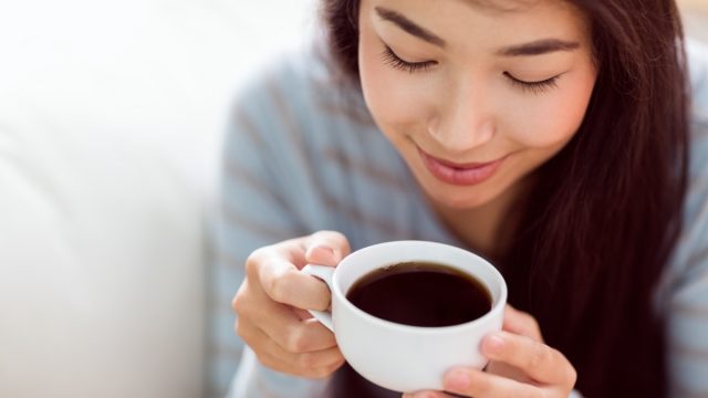 Young Asian woman drinking