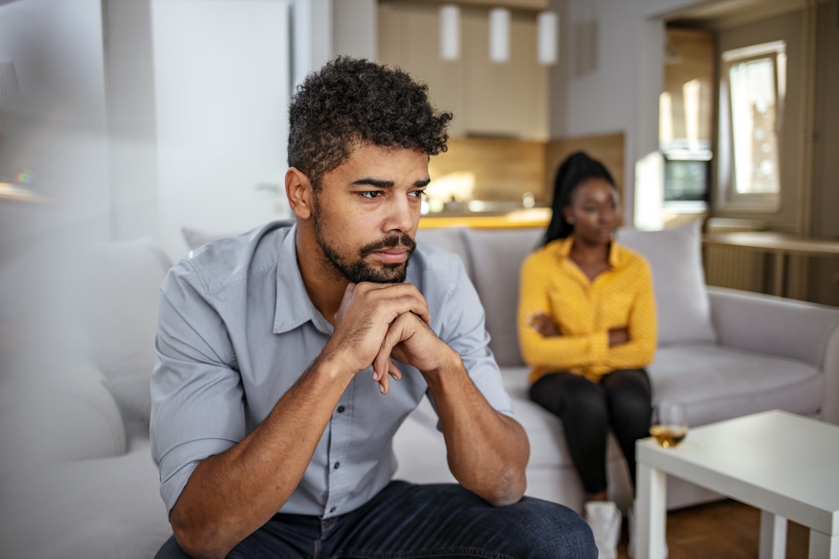 Unhappy Young American Woman Having Argument With Man At Home.