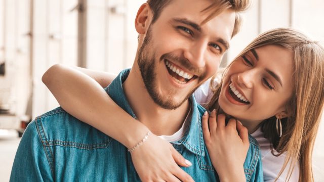 Confident man and woman smiling