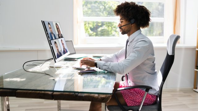 young black man wearing boxers on video call