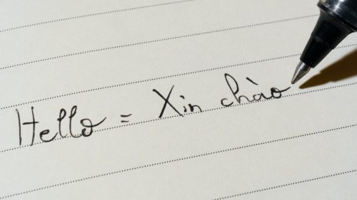Hello translated into Vietnamese on paper