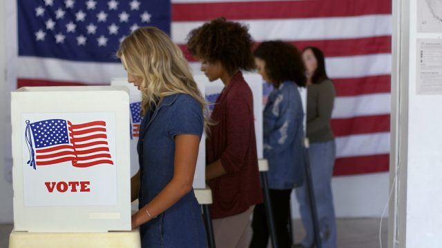 women voting at voting booth