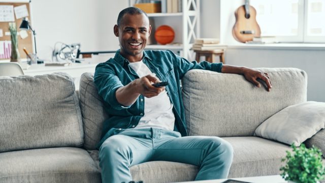 man watching nature tv shows to cure boredom