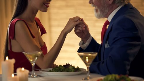 Older man on a date with a younger woman