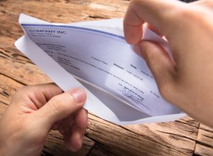 Person looking at paycheck