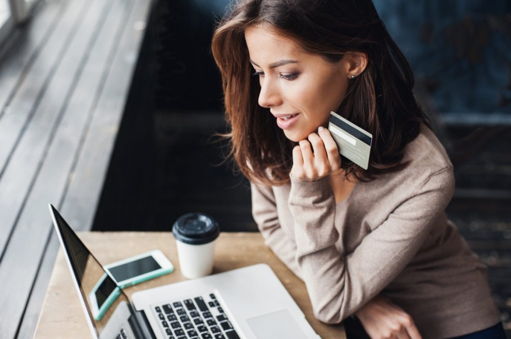 woman shopping online with credit card