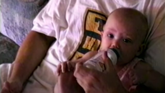 Hailie Jade being held by Eminem in the Mockingbird video