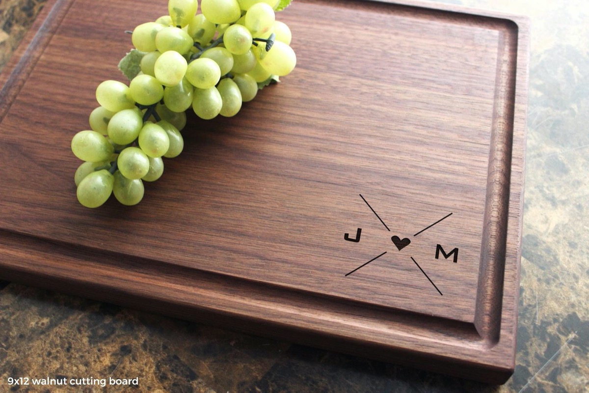 wooden cutting board reading "j heart m"