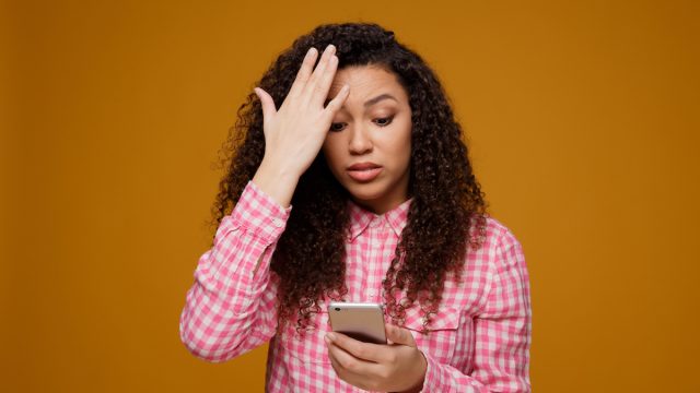 woman frustrated with dating app