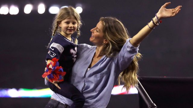 Gisele Bundchen celebrates with daughter Vivian Brady after the New England Patriots defeated the Atlanta Falcons during Super Bowl 51 at NRG Stadium on February 5, 2017 in Houston, Texas