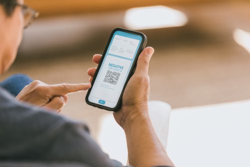 Senior man confirms COVID-19 test result via phone app