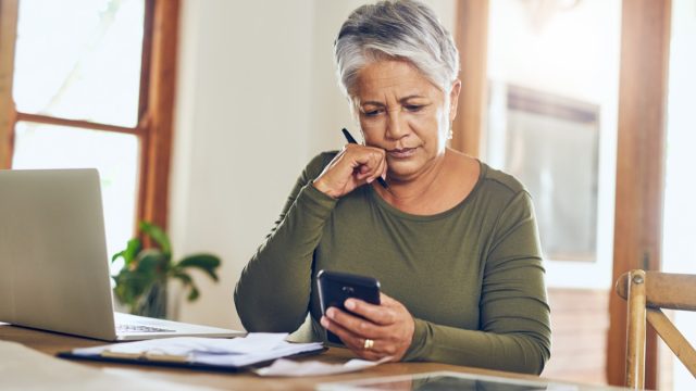 Woman looking at bills