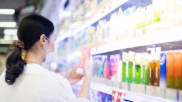 Woman looking at beauty product
