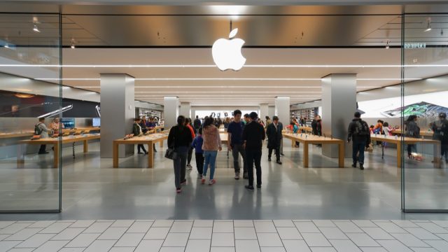 apple store exterior in mall with customers walking in