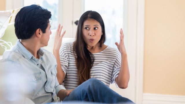 woman and man fighting at home