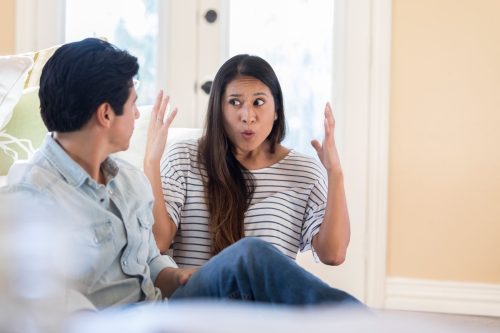woman and man fighting at home