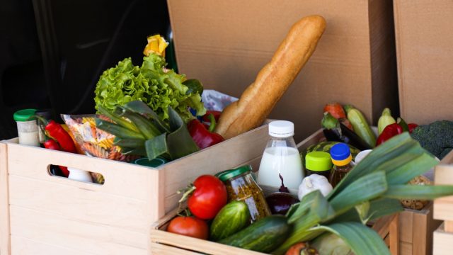 crates of produce and fresh food in the back of a truck