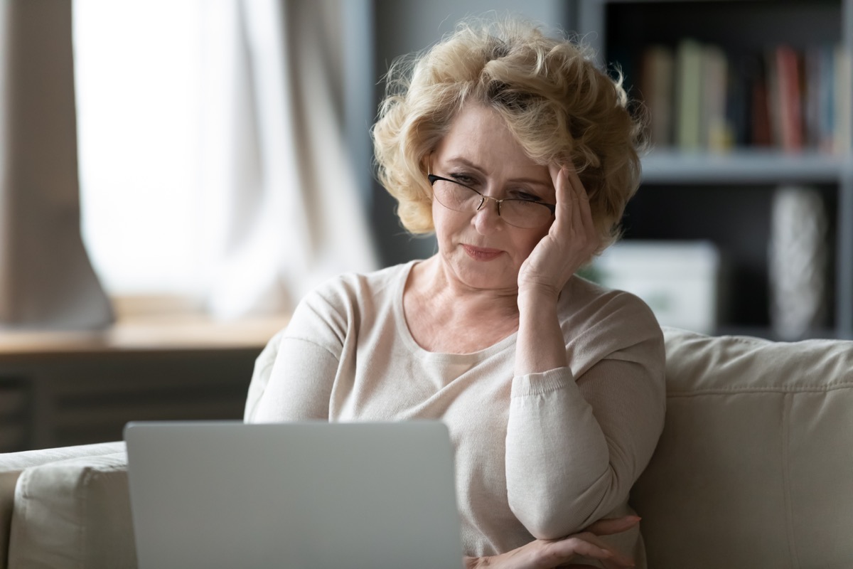Older woman tressed on computer