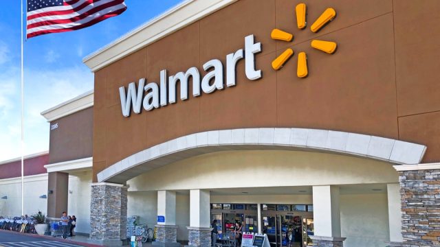 walmart exterior entrance with american flag flying nearby