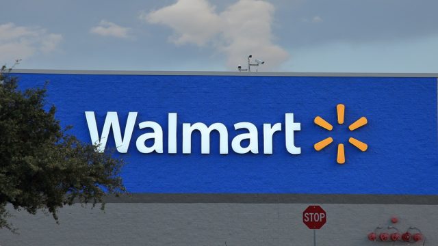 walmart store sign with sunburst logo