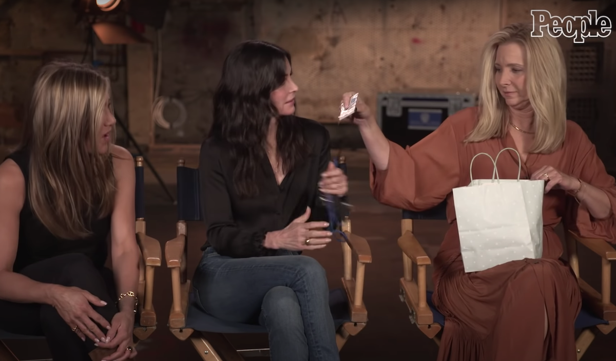 Jennifer Aniston, Courtney Cox, and Lisa Kudrow being interviewed by "People"