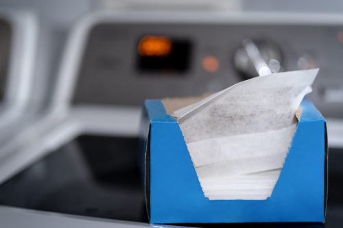 a blue box of dryer sheets on a dryer