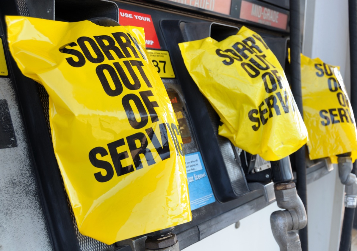 Empty gas pump with "Out of Service" notices.