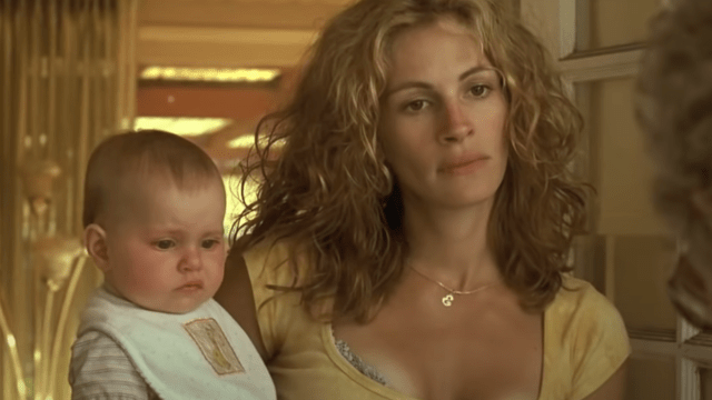 Julia Roberts holding a baby in "Erin Brockovich"