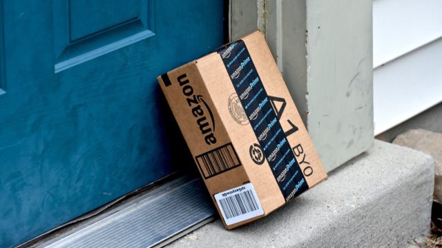 amazon box outside blue residential door
