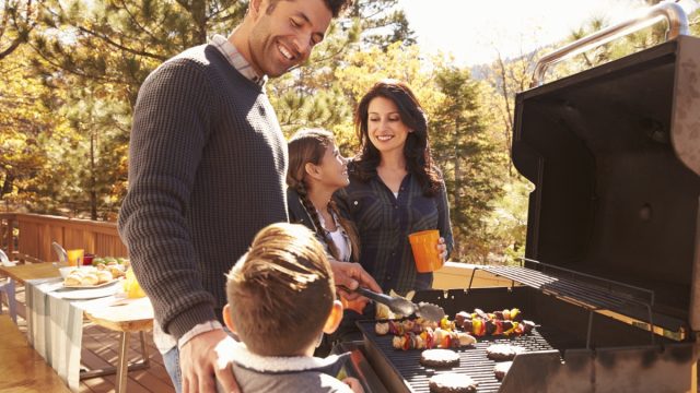 young family having barbecue