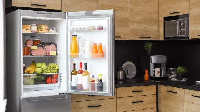 open fridge with drinks in the door