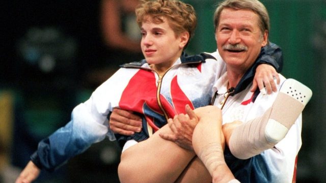 Bela Karolyi carrying Kerri Strug at the 1996 Olympics