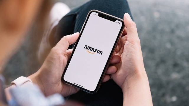 person using amazon app on smartphone