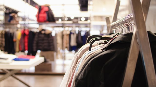 Clothing, including fur-lined coats, at department store
