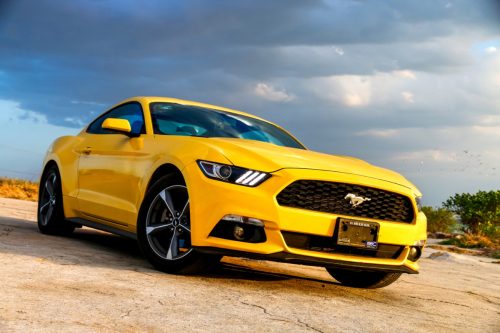 A yellow Ford Mustang