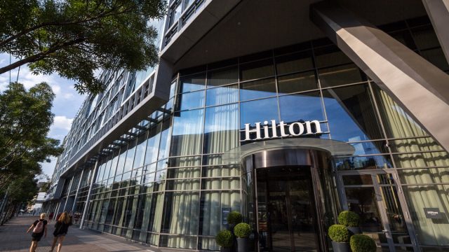 BELGRADE, SERBIA - AUGUST 14, 2018: Hilton logo on the entrance their newly opened hotel of Belgrade, during the afternoon. Hilton is one of the biggest brands of luxury hotels
