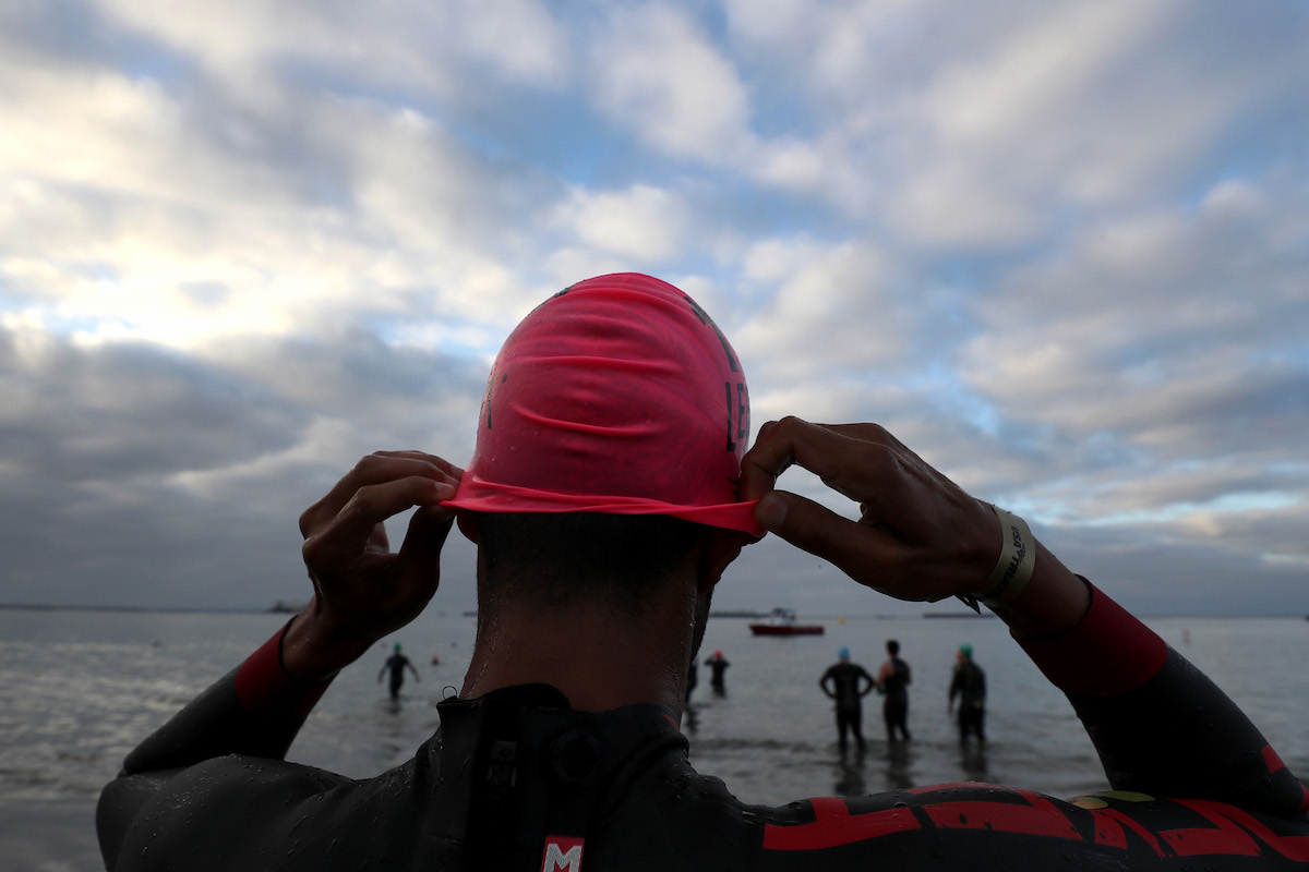 Akhil Viz adjusts his swim cap prior to competing in the Legacy Triathlon-USA Paratriathlon National Championships on July 20, 2019 in Long Beach, California