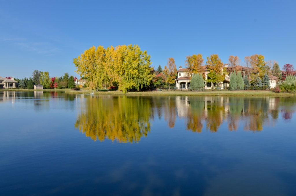 a lake, trees, and houses in Cherry Hills Village, Colorado